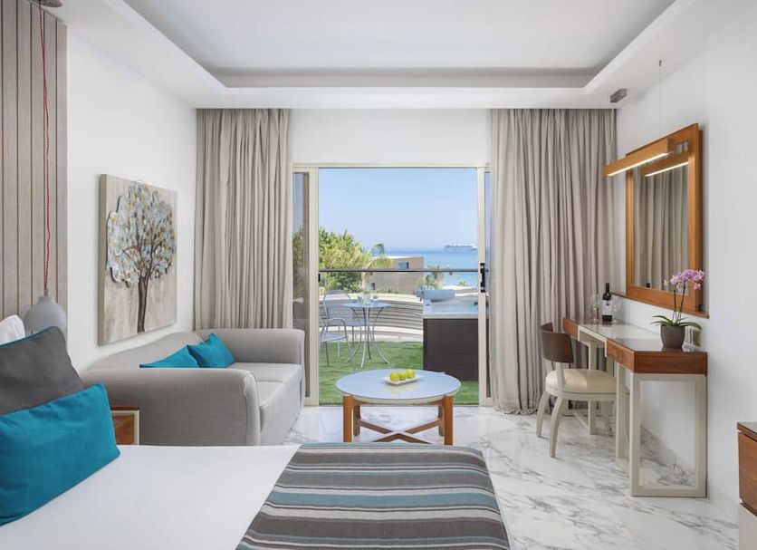 Atlantica Bay - Adults Only in Limassol guest room with balcony sea view and seating area