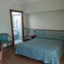 Albergo Michieletto in Montano Lucino room with double bed, wood floors and adjoining bathroom doorway