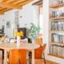 Alla Torre Del Barbarossa B&b Foresteria lounge with round table, fireplace, bookshelves and wood beams in Mandello del Lario