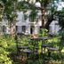 YXIE - manoir des arts in Villeblevin with a garden patio and wrought-iron table and chairs
