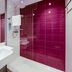 Premier Inn Karlsruhe City Am Wasserturm bathroom with white sink, glass shower and magenta tiled wall in Karlsruhe