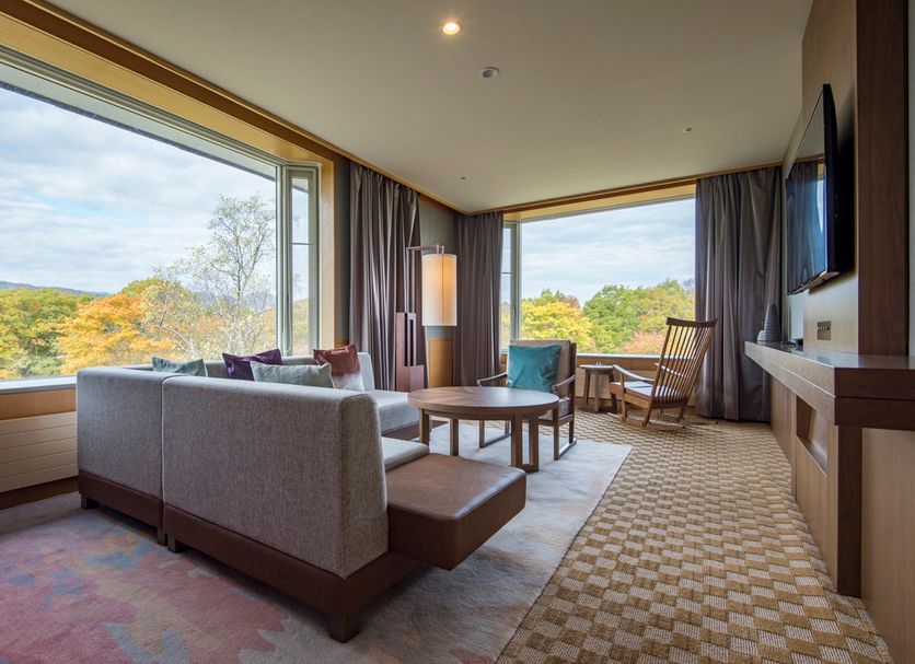 Hakodate-Onuma Prince Hotel in Nanae lounge with large windows and forest view