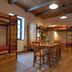 Turn Hostel Ljubljana shared dorm room with bunk beds, wooden table and chairs, and wood-beam ceiling