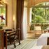 Hillview Golf Resort Dongguan guest room with balcony, garden view, desk, and TV in Dongguan
