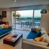 Hpc Suites in Cassis living room with sea-view terrace and outdoor dining set