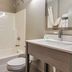 Quality Inn & Suites Grove City-Outlet Mall bathroom with shower-tub combo, toilet and vanity in Grove City