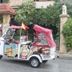 Villa Ambra B&B in Noto with a colorful tuk-tuk parked outside the entrance