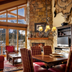 Faraway Jackson Hole in Teton Village living room with stone fireplace, lofted windows and mountain view