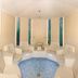 Urlaubshotel Binder in Büchlberg spa room with circular seating and blue tiled floor
