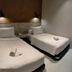 Patria Garden Hotel in Blitar, twin beds room with TV and desk