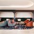 Hyatt Regency London Stratford lounge with curved seating, round tables and a modern open lobby in London