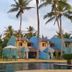 Omali São Tomé hotel with palm trees, pool, and colorful beachfront villas in São Tomé