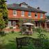 Best Western Sysonby Knoll Hotel in Melton Mowbray, red-brick hotel with garden patio and seating