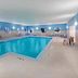 Holiday Inn Express & Suites Dumas indoor pool with hot tub and lounge chairs
