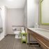 Accessible bathroom at Hampton Inn Junction City with roll-in shower, toilet, and vanity