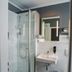 Hotel Am Schloss Biebrich bathroom in Wiesbaden with glass shower, sink and mirror