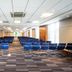 Holiday Inn London - Gatwick Airport By IHG conference room with rows of blue chairs