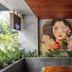 Triple E Hotel Metro Ben Thanh in Ho Chi Minh City, mural art on a hotel terrace with plants