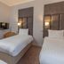 Best Western Aberavon Beach Hotel in Port Talbot twin guest room with two single beds and wall-mounted TV