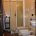 Flegrea House - Casa Rosa bathroom with shower enclosure, bidet, toilet and sink in Pozzuoli