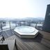 Business Hotel Cuore Tsuruga rooftop terrace with hot tub and city mountain view