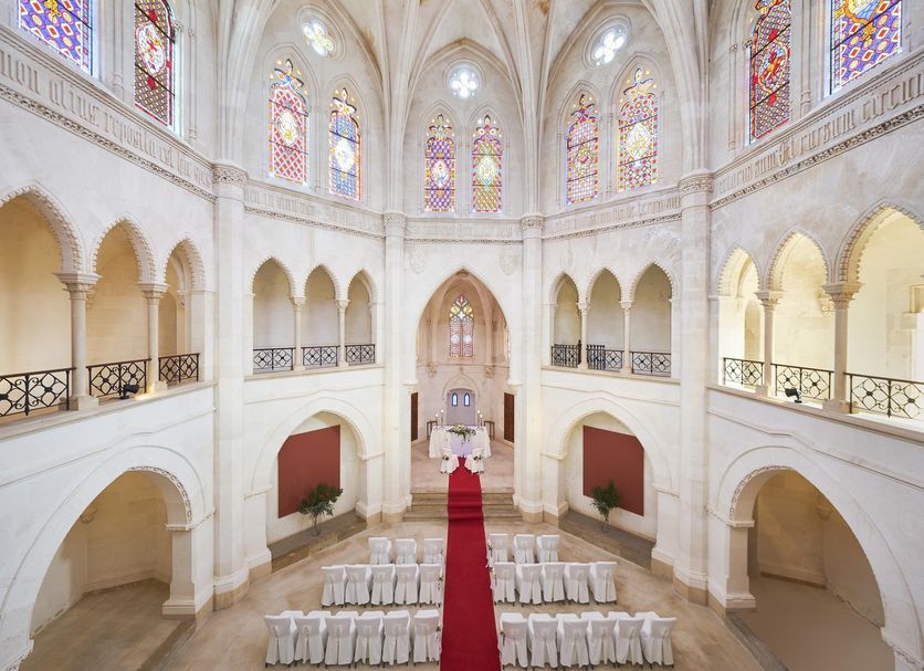 Zoetry Mallorca Wellness & Spa chapel-style event space in Llucmajor with arched balconies and stained glass