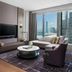 The St. Regis Hong Kong suite with harbor view, floor-to-ceiling windows and lounge seating