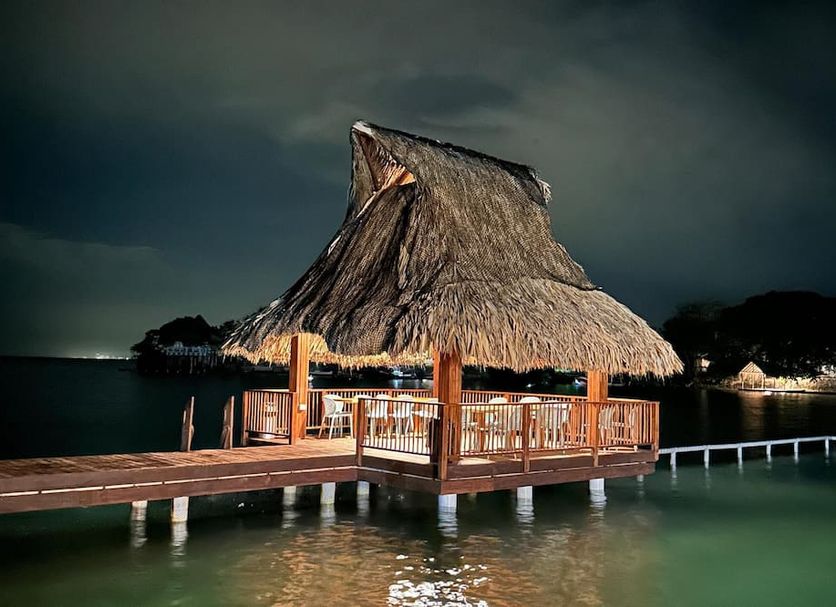 Hotel Isla del Sol overwater thatched pavilion on Isla Grande del Rosario at night