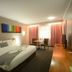 Hospitality Kalgoorlie, SureStay Collection by Best Western room with king bed, desk, TV and window curtains