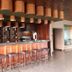 Estalagem Vianorte in Matosinhos bar with wooden counter, tall stools and bottle display