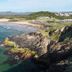 Coastal cliff and ocean view near Matador Motor Inn in Coffs Harbour, with beach and mountains