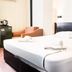 Hotel Guleryuz Antalya room with double bed, armchair, mini fridge and kettle