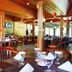 Sanghyang Indah Spa resort in Anyar restaurant with wooden tables, chairs and lantern lighting
