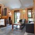 Hospedium Hacienda Las Cavas in Olmedo: rustic suite with kitchenette, seating area, and stone floor