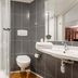 B&B HOTEL Maubeuge-Louvroil bathroom with shower, toilet and sink in Louvroil