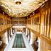 The Shankly Hotel in Liverpool, grand indoor hall with long central pool and ornate ceiling