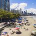 Hotel Arco Do Sol in Balneário Camboriú with beachfront skyline view and crowded sandy beach