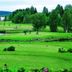 Spa Hotel Peurunka in Laukaa with a lakeside golf course, green fairways, and trees