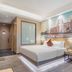Zhongshan Tegao Business Hotel room in Zhongshan with king bed, city mural, and modern wood finishes