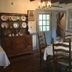 Spread Eagle Tavern and Inn in Hanoverton: dining room with set tables, hutch, and chandelier