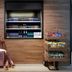 Moxy Milton Keynes snack and drink display with luggage cart in Milton Keynes