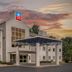 SureStay Plus by Best Western Niagara Falls East exterior with covered entrance at dusk