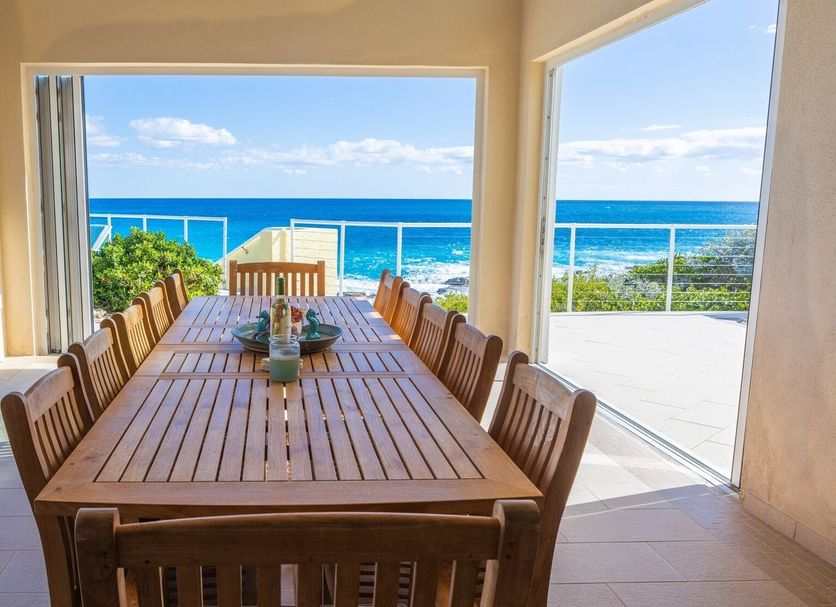 Stella Maris Resort Club dining room with long table and ocean views in Stella Maris