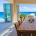 Stella Maris Resort Club dining room with long table and ocean views in Stella Maris