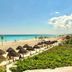 Condo in Ocean Front Resort, Cancún: oceanfront beach with thatched umbrellas and turquoise sea