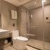 Home Inn Plus Foshan Shunde Qinghui Garden Rt-Mart bathroom with sink, toilet and glass shower