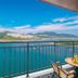 Onda D'oro Hostel in Yeosu balcony with table, chairs and panoramic sea and mountain view