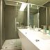 Mercure Nerocubo Rovereto bathroom with glass shower and modern double sink vanity