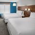 Holiday Inn Express Kansas City - At The Legends by IHG guest room with two beds and desk