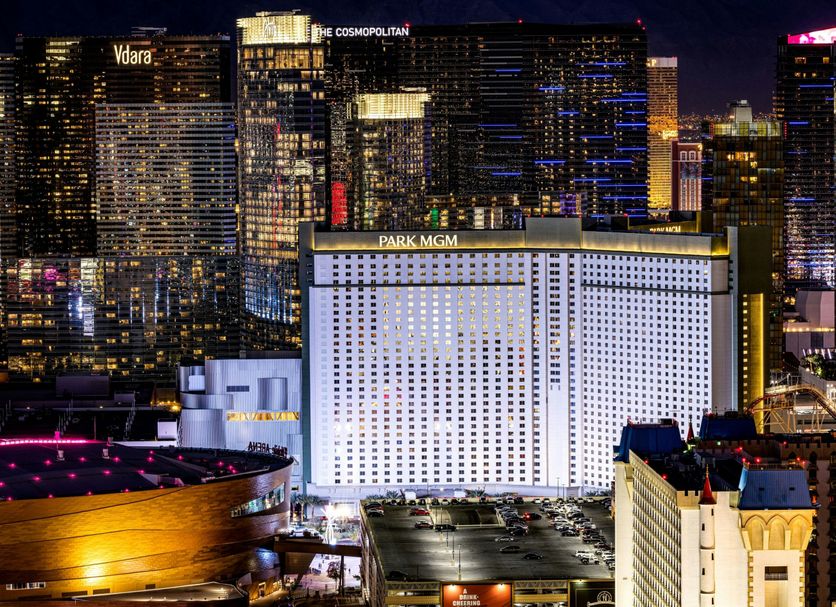 The Reserve at Park MGM in Las Vegas with illuminated Strip skyline and Park MGM facade at night